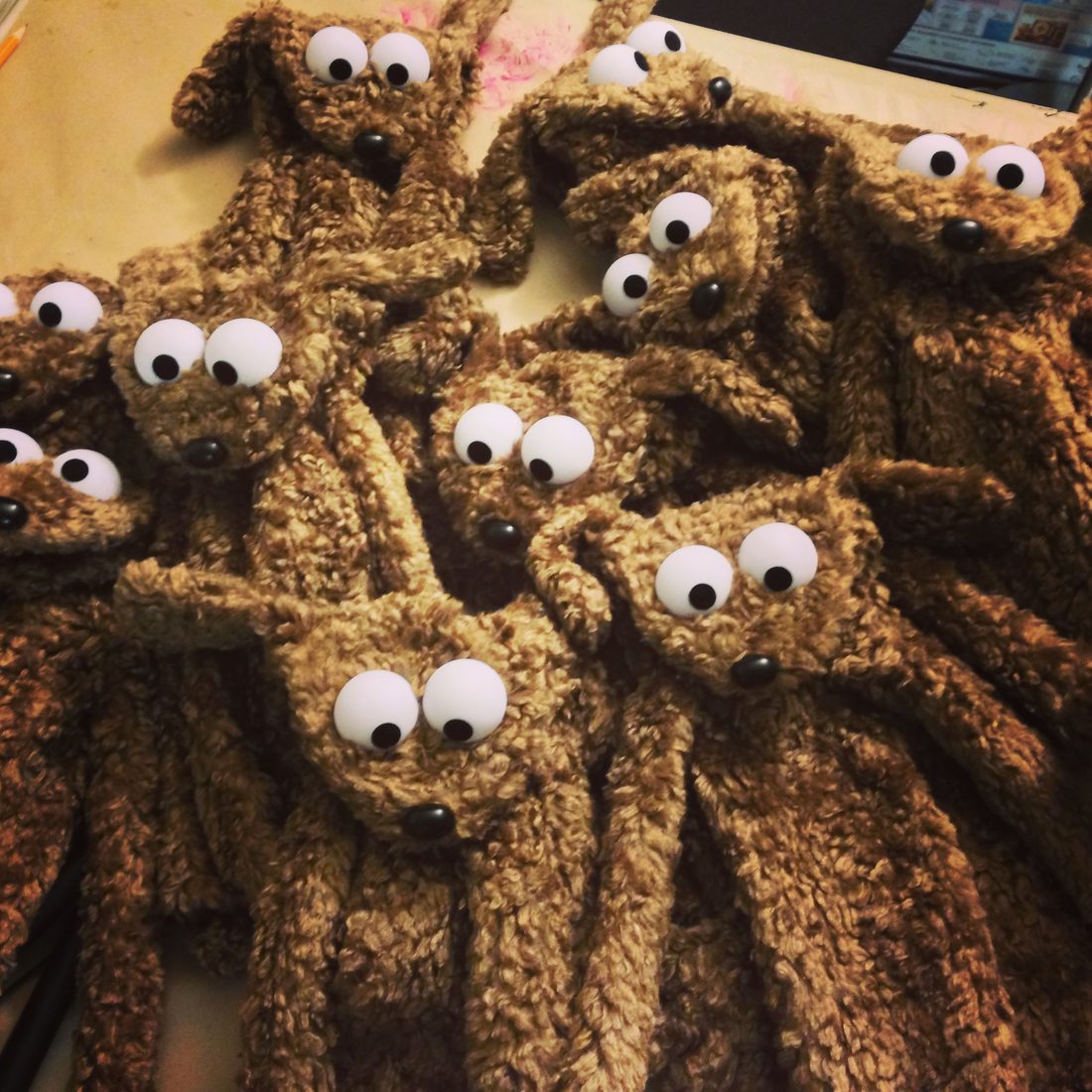 A joyful gathering of handmade dog puppets