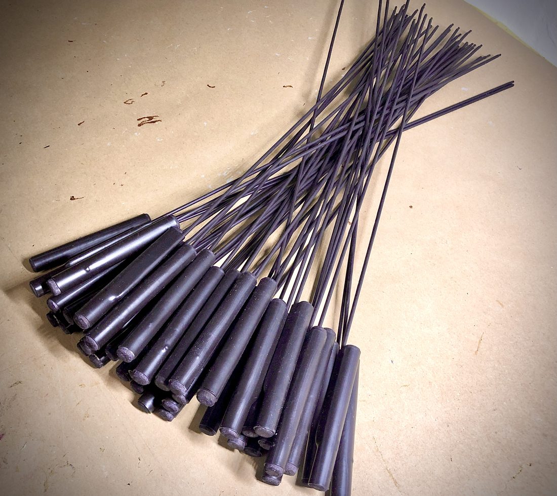 A bundle of newly made puppet control rods